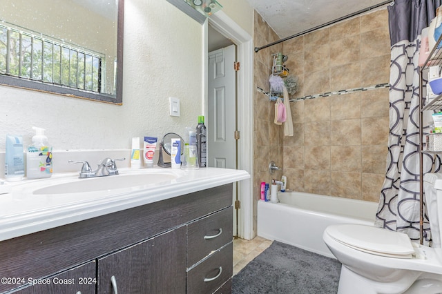 full bathroom with vanity, toilet, shower / bathtub combination with curtain, and tile patterned floors