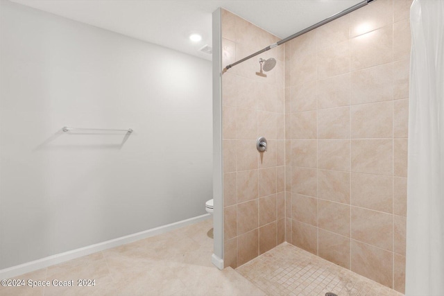 bathroom with walk in shower, toilet, and tile patterned floors