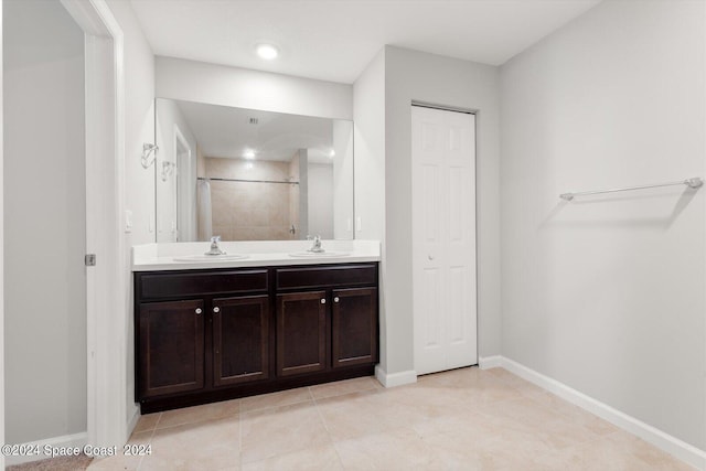 bathroom with vanity, tile patterned flooring, and curtained shower