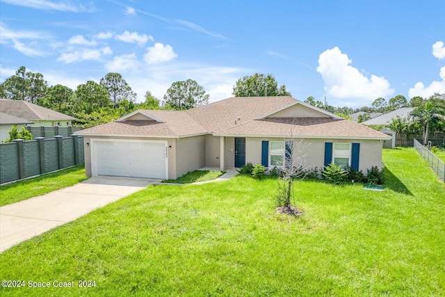 single story home featuring a garage and a front lawn