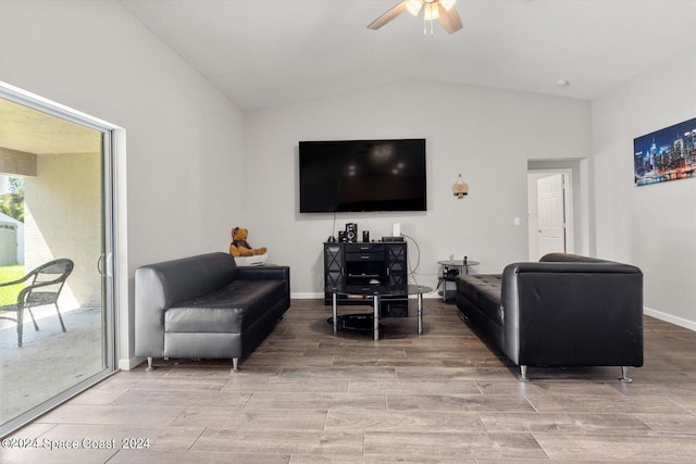 living room featuring lofted ceiling, hardwood / wood-style floors, and ceiling fan