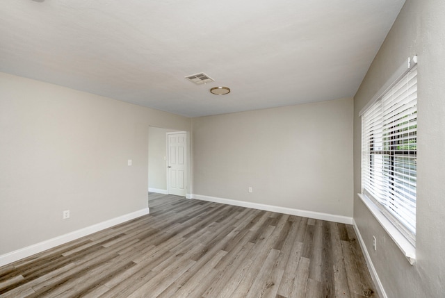 unfurnished room featuring light wood-type flooring