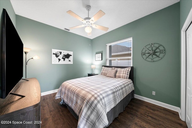 bedroom featuring dark hardwood / wood-style floors and ceiling fan