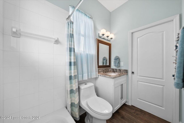 full bathroom featuring vanity, toilet, wood-type flooring, and shower / bathtub combination with curtain