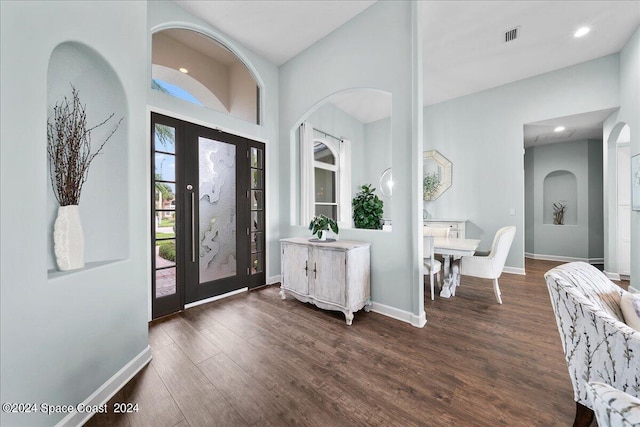 foyer entrance featuring dark hardwood / wood-style floors