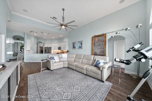 living room with sink, dark wood-type flooring, crown molding, and ceiling fan