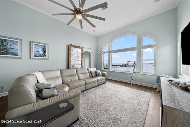 living room featuring crown molding, dark hardwood / wood-style floors, and ceiling fan