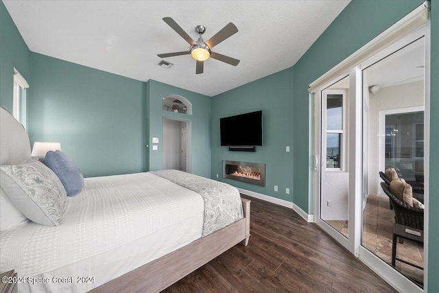 bedroom with dark wood-type flooring and ceiling fan