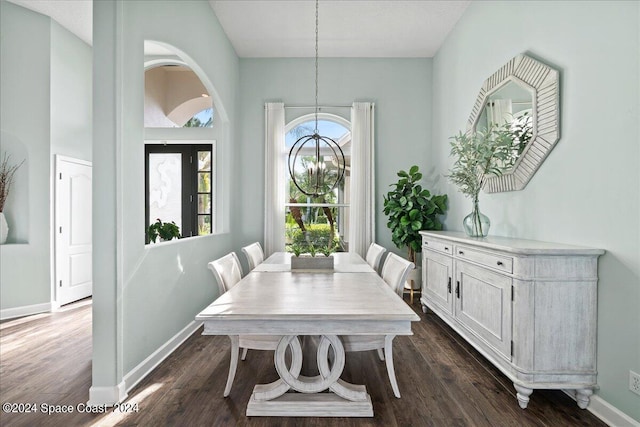 dining room featuring a chandelier and dark hardwood / wood-style floors