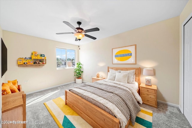 carpeted bedroom featuring ceiling fan