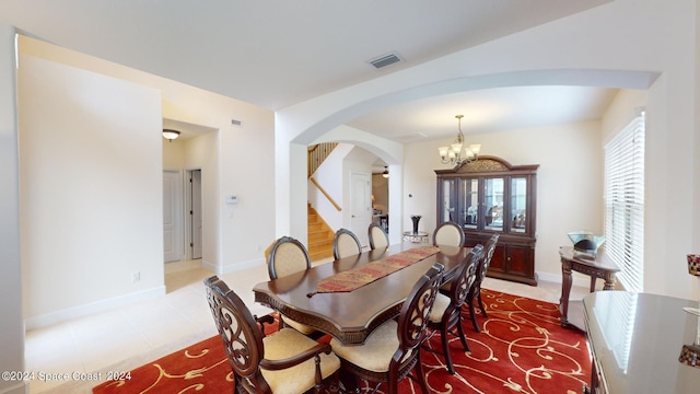 dining space with an inviting chandelier