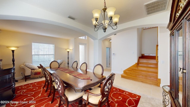 dining space featuring a chandelier