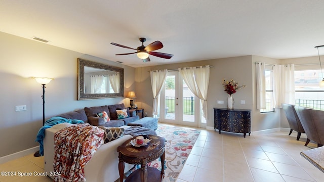 living room featuring ceiling fan, light tile patterned flooring, and french doors