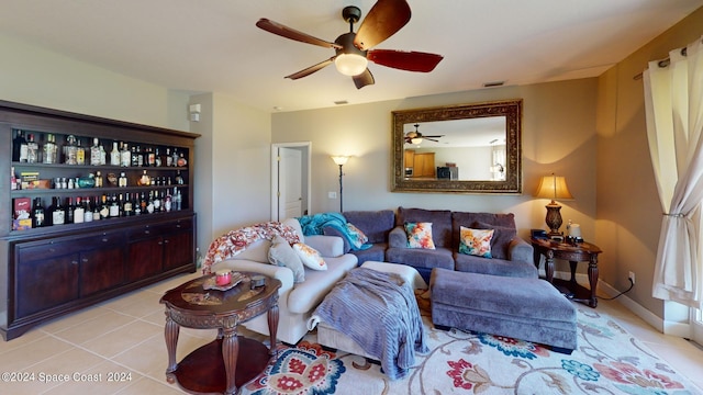 tiled living room with ceiling fan