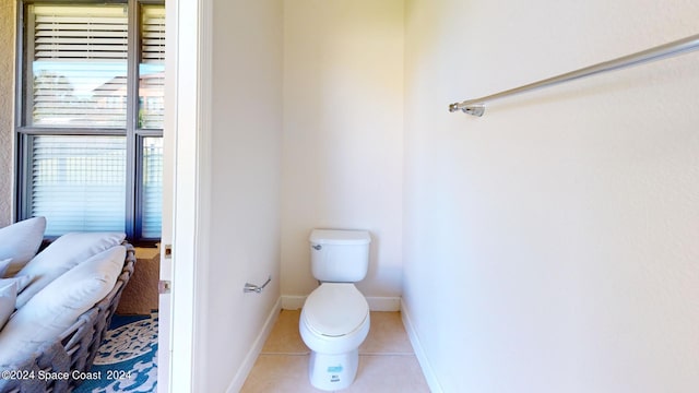 bathroom with tile patterned floors and toilet