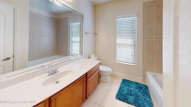 bathroom featuring tile patterned flooring, vanity, and toilet