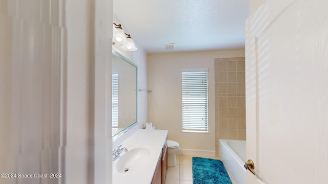 bathroom with tile patterned flooring, vanity, and toilet