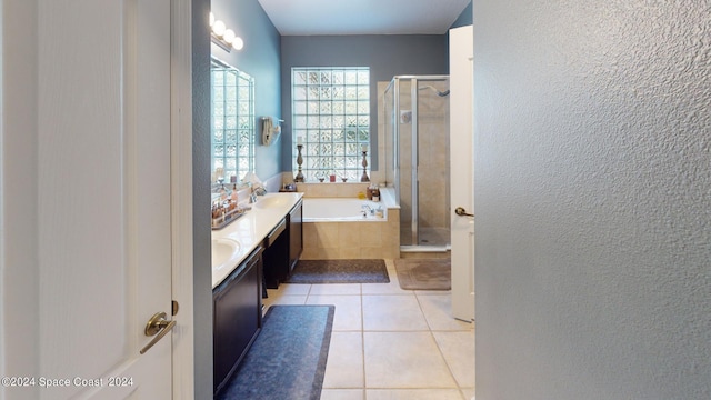 bathroom featuring vanity, plus walk in shower, and tile patterned floors