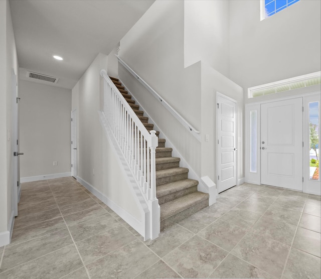 entrance foyer with a towering ceiling