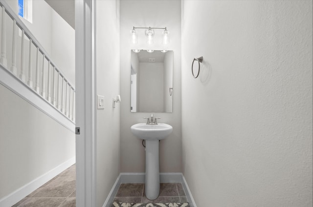 bathroom with tile patterned floors