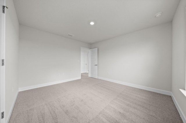 spare room featuring carpet flooring