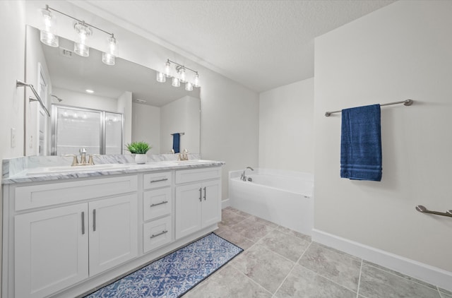 bathroom featuring plus walk in shower, tile patterned flooring, a textured ceiling, and vanity