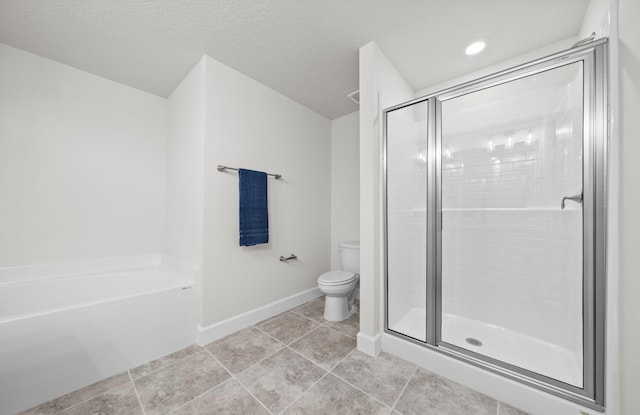 bathroom with a textured ceiling, plus walk in shower, toilet, and tile patterned floors