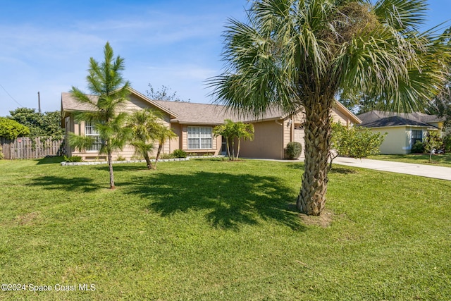 ranch-style house featuring a front lawn