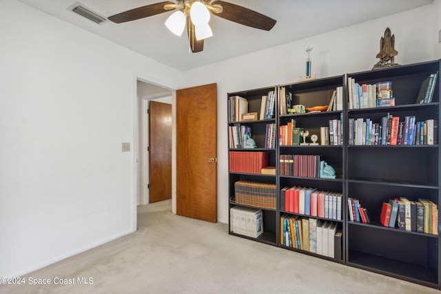 interior space featuring ceiling fan and carpet flooring