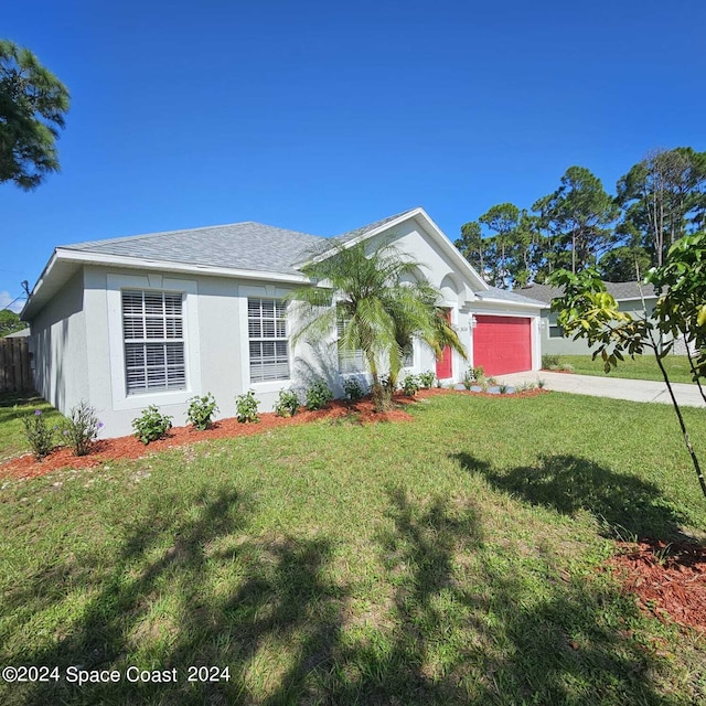 single story home featuring a garage and a front yard