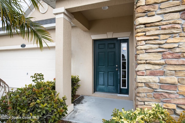 property entrance with a garage