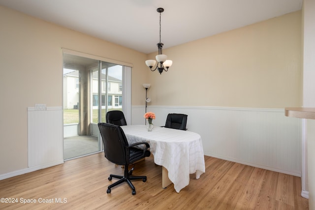 office with a notable chandelier and light hardwood / wood-style flooring