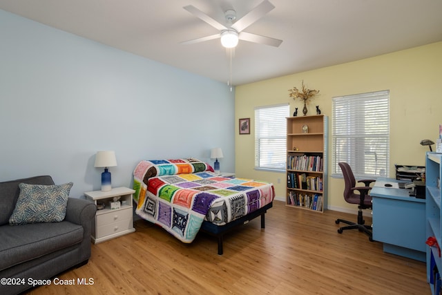 bedroom featuring ceiling fan and light hardwood / wood-style flooring