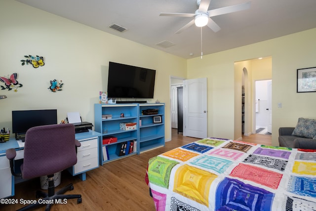 bedroom with hardwood / wood-style flooring and ceiling fan