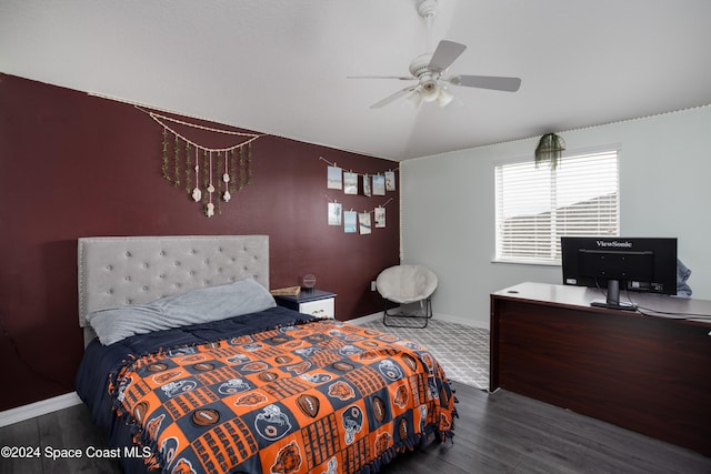 bedroom featuring ceiling fan and dark wood-type flooring