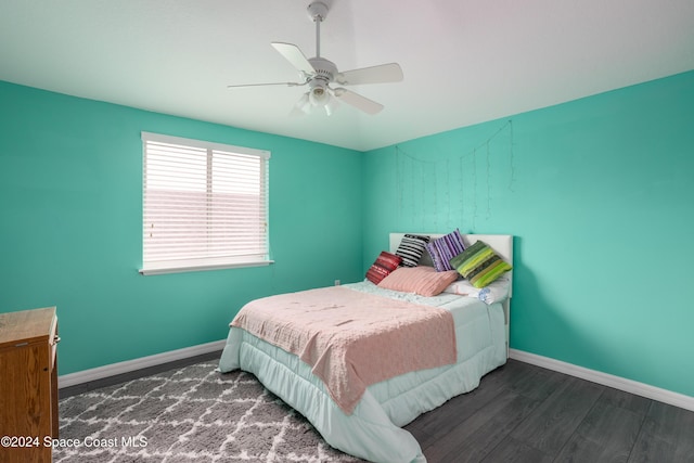 bedroom featuring ceiling fan and dark hardwood / wood-style flooring