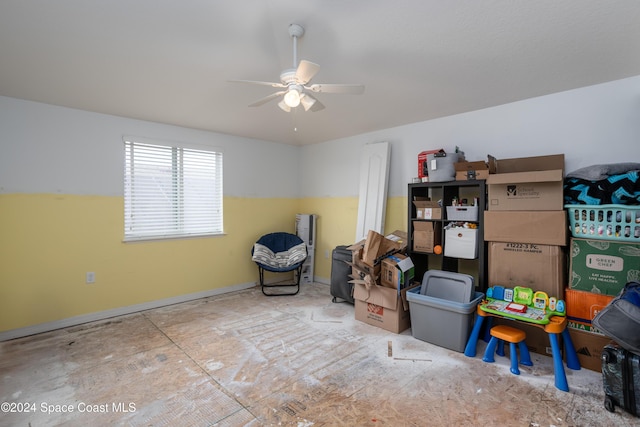 storage area featuring ceiling fan