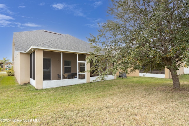 view of yard with a sunroom