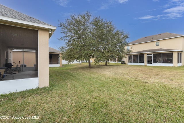 view of yard featuring a sunroom