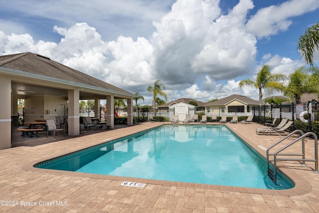 view of pool featuring a patio