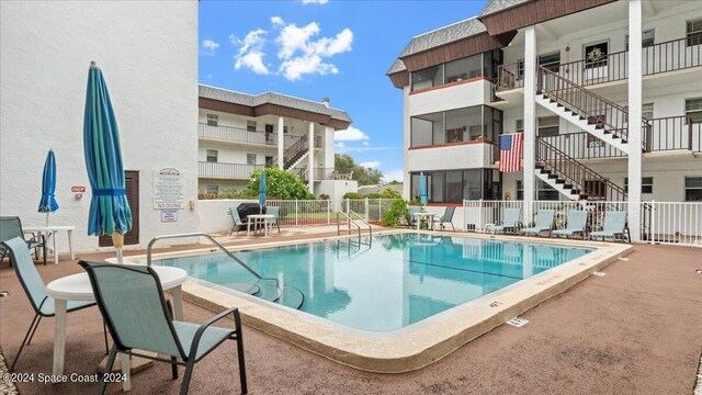 view of swimming pool with a patio area