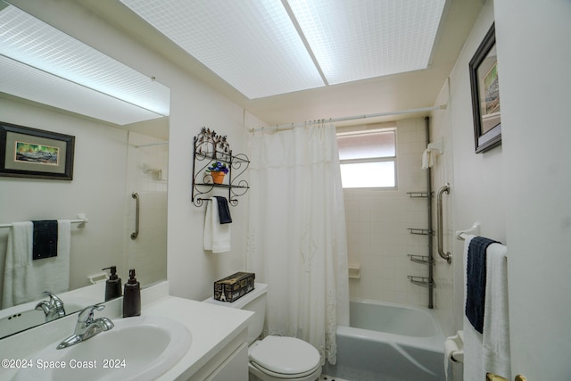 full bathroom featuring vanity, shower / tub combo with curtain, and toilet