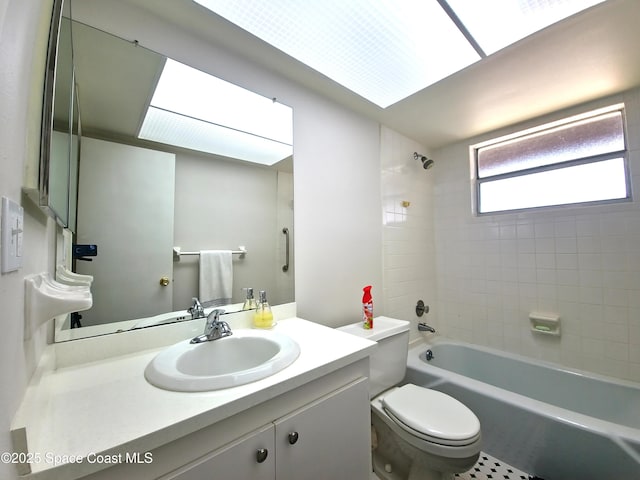 full bath with toilet, vanity, and shower / washtub combination