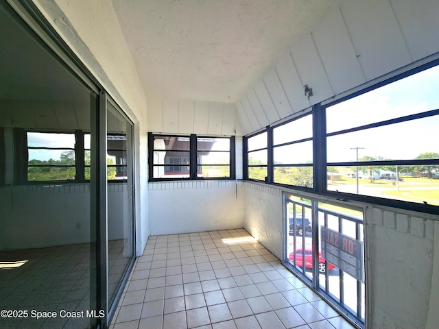unfurnished sunroom with a healthy amount of sunlight