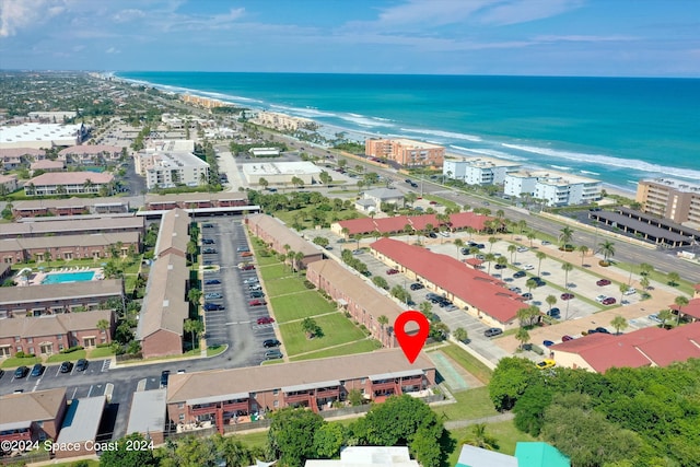 bird's eye view featuring a water view and a view of the beach