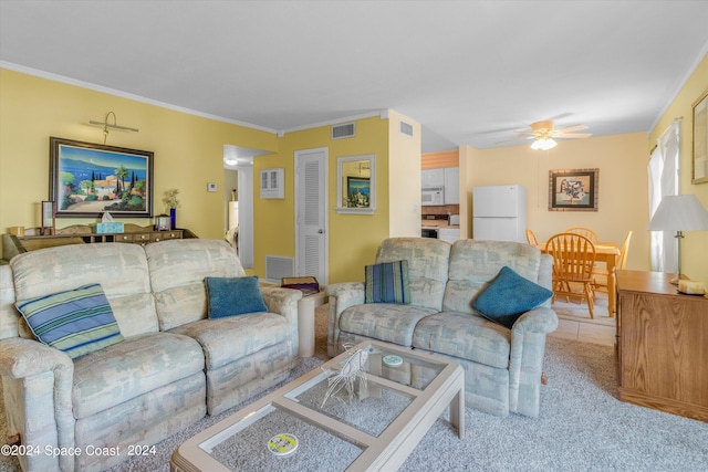 living room with ceiling fan, light colored carpet, and crown molding