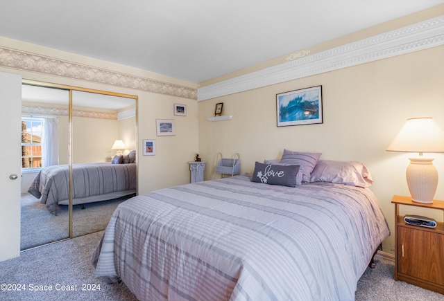 bedroom featuring carpet floors and a closet