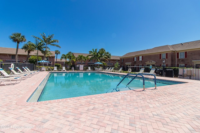 view of swimming pool with a patio