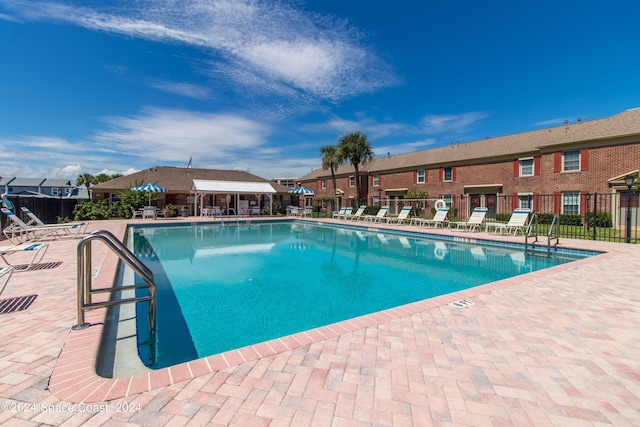 view of swimming pool featuring a patio area