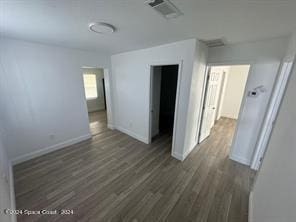 unfurnished bedroom with dark hardwood / wood-style floors